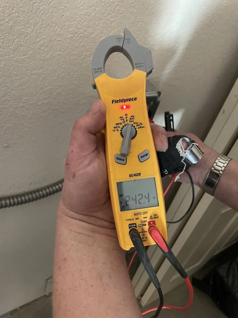 Voltage testing with clamp meter during Electrical Installation Services in Winchendon